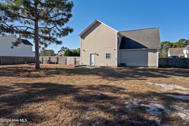 view of property exterior featuring a lawn