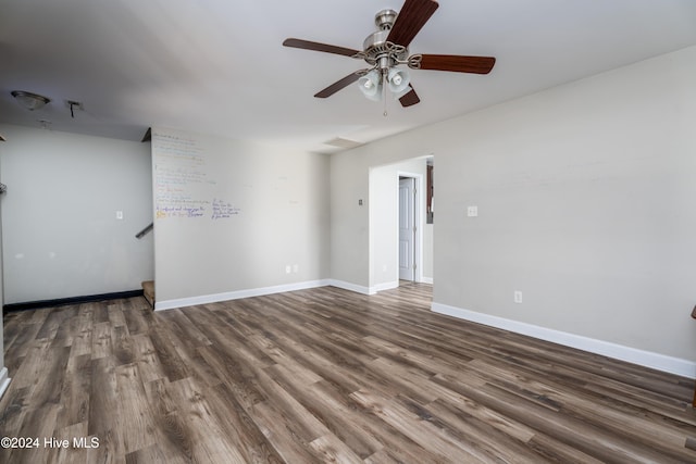 unfurnished room featuring ceiling fan and dark hardwood / wood-style floors