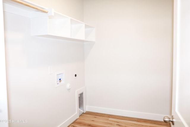 clothes washing area with electric dryer hookup, hookup for a washing machine, and light hardwood / wood-style floors