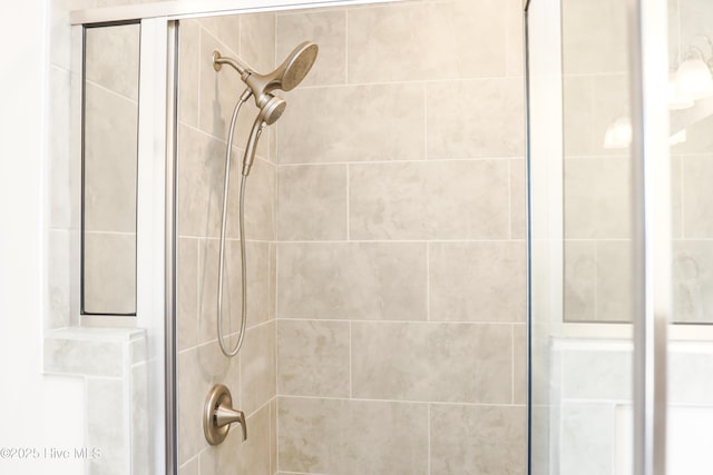 interior details with a tile shower