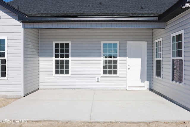 property entrance with a patio