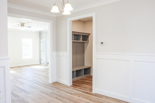 mudroom featuring light wood-type flooring, ceiling fan with notable chandelier, and ornamental molding