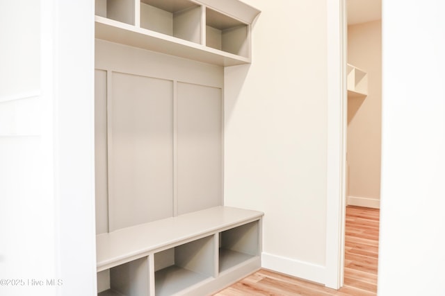 mudroom with hardwood / wood-style floors