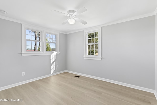 unfurnished room featuring light hardwood / wood-style flooring, ceiling fan, and ornamental molding