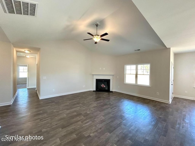 unfurnished living room with ceiling fan, plenty of natural light, and dark hardwood / wood-style floors