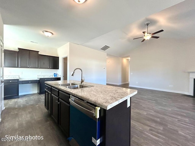 kitchen with dark wood-type flooring, sink, an island with sink, and stainless steel dishwasher