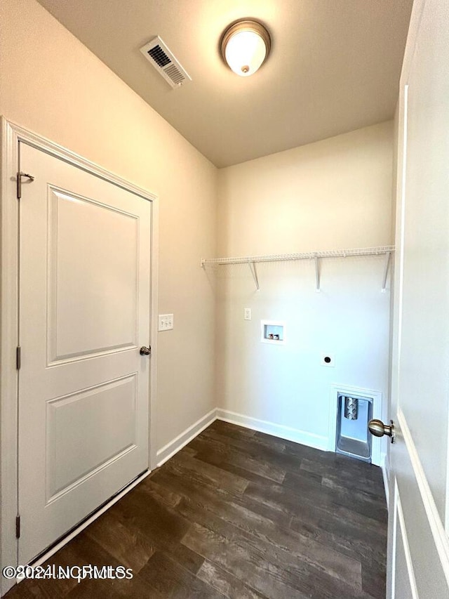 laundry room featuring hookup for an electric dryer, hookup for a washing machine, and dark hardwood / wood-style flooring