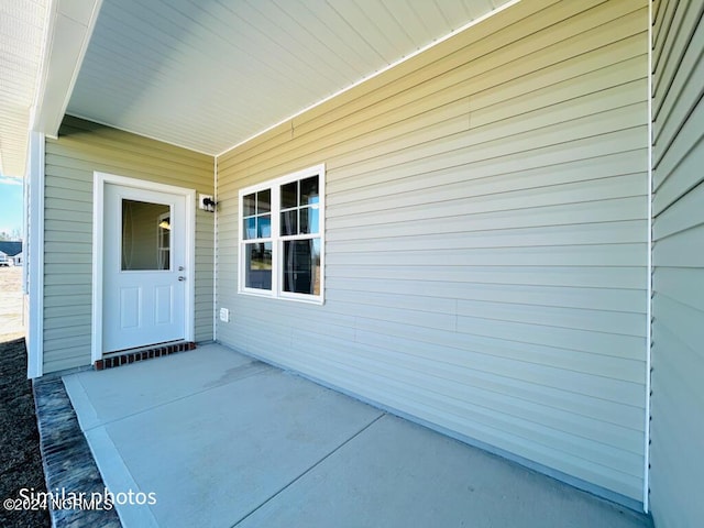 entrance to property with a patio