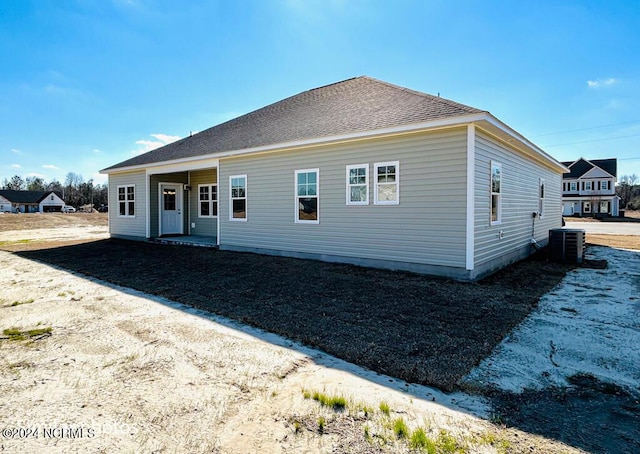 back of house featuring central AC