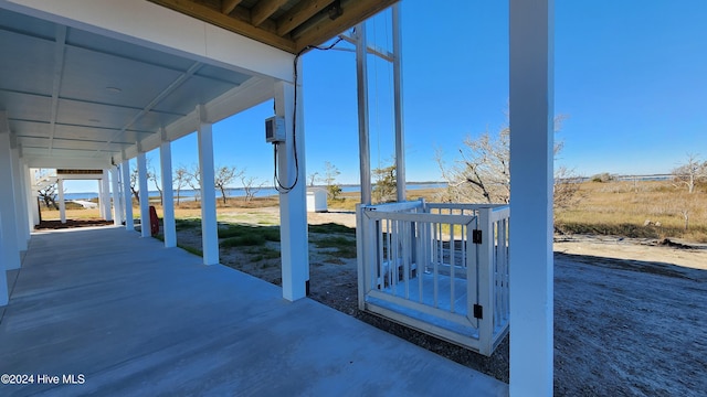 view of patio / terrace with an AC wall unit