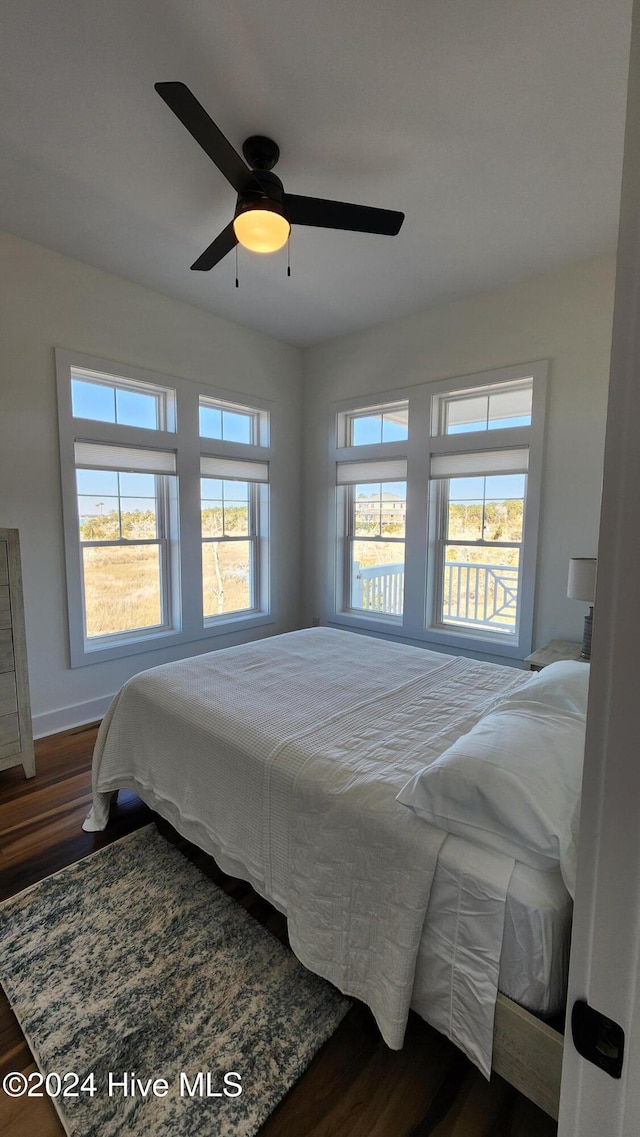 bedroom featuring dark hardwood / wood-style flooring and ceiling fan