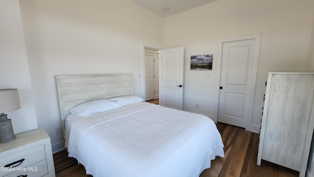 bedroom featuring dark wood-type flooring