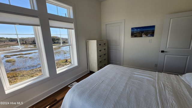 bedroom featuring dark hardwood / wood-style flooring