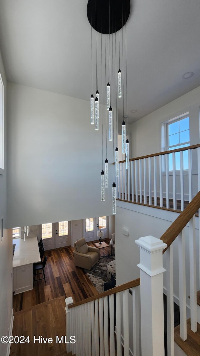 stairway featuring wood-type flooring