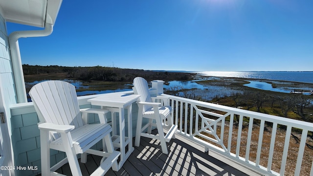 balcony featuring a water view