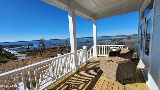 balcony featuring a water view