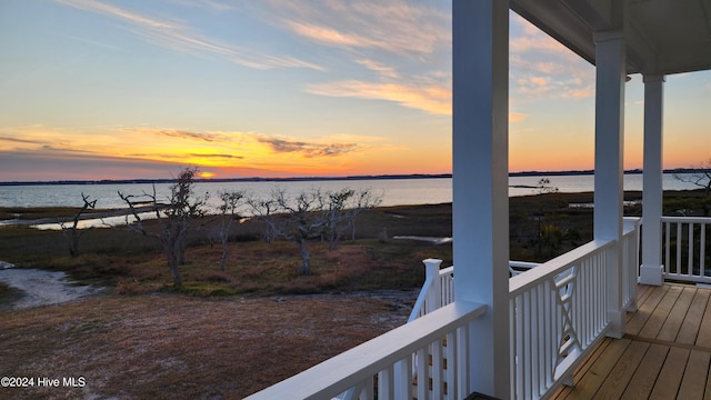 deck at dusk with a water view