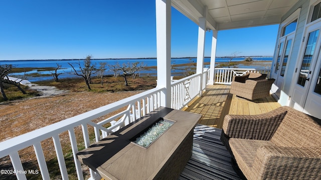 balcony featuring a water view