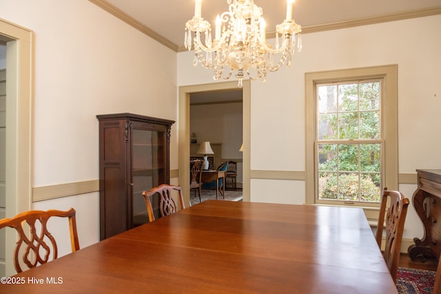 dining room with an inviting chandelier and ornamental molding