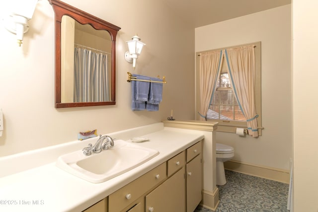 bathroom with vanity and toilet