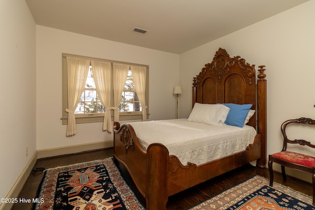 bedroom featuring dark hardwood / wood-style floors