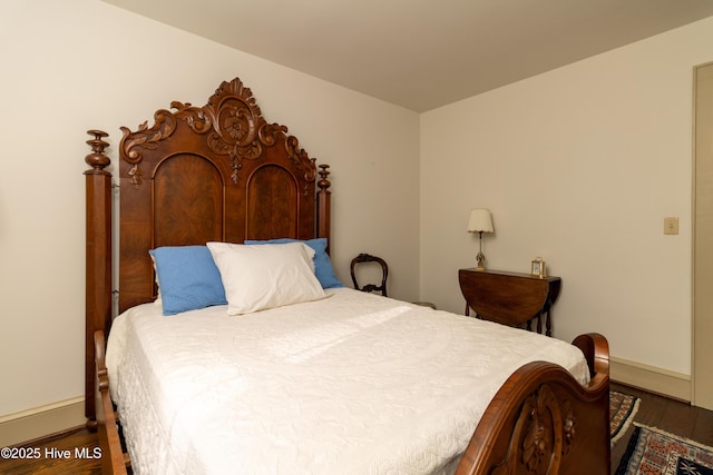 bedroom featuring dark hardwood / wood-style floors