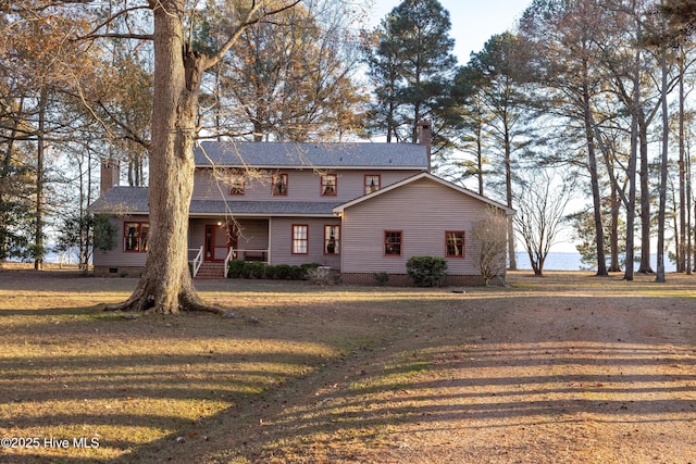 front of property with a porch and a front lawn