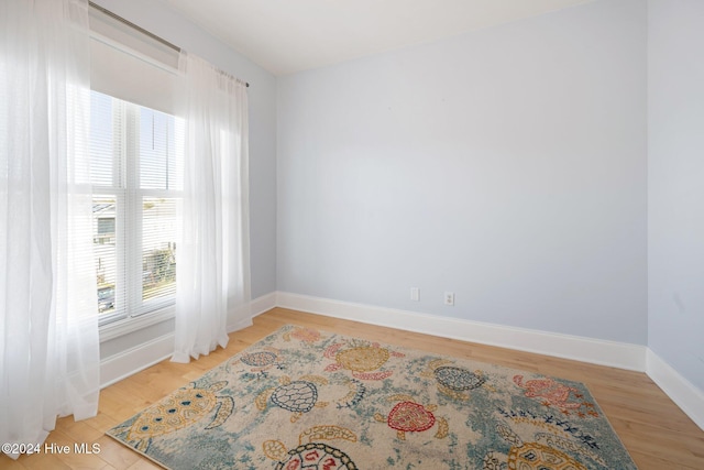 unfurnished room featuring light wood-type flooring