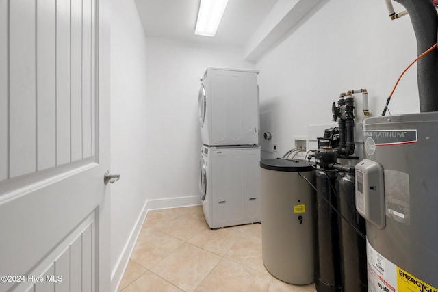 utilities with stacked washer and dryer and water heater