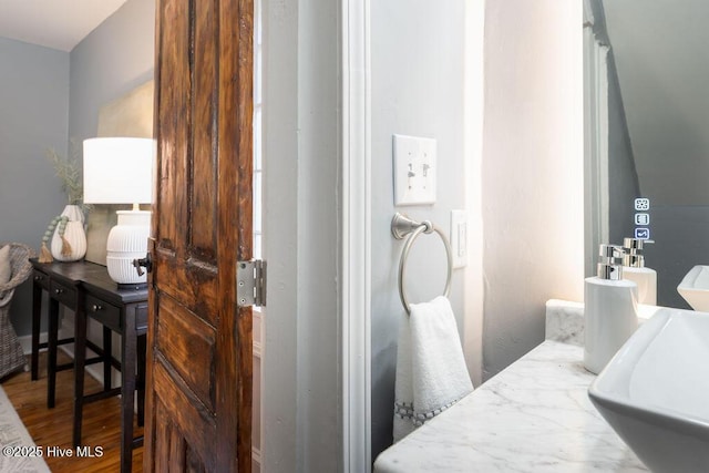 bathroom with sink and wood-type flooring