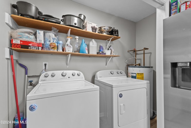 washroom featuring electric water heater and washing machine and clothes dryer