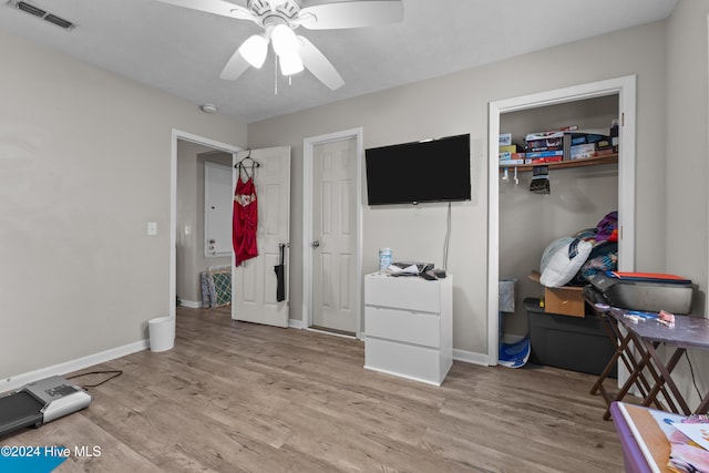 bedroom featuring light wood-type flooring and ceiling fan