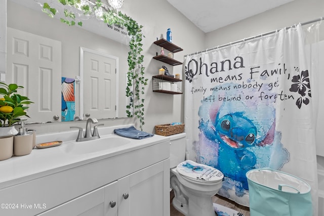 bathroom featuring vanity and toilet