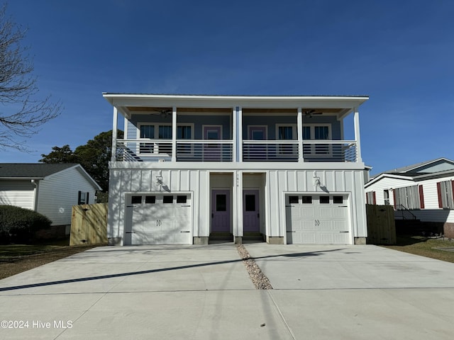 view of front of property featuring a balcony and a garage