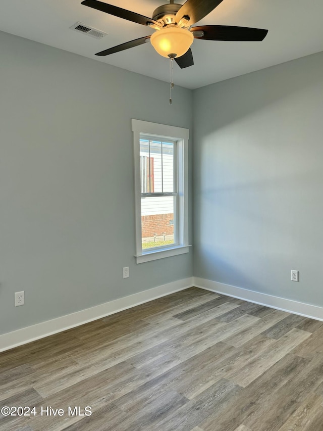 unfurnished room featuring ceiling fan and light hardwood / wood-style floors