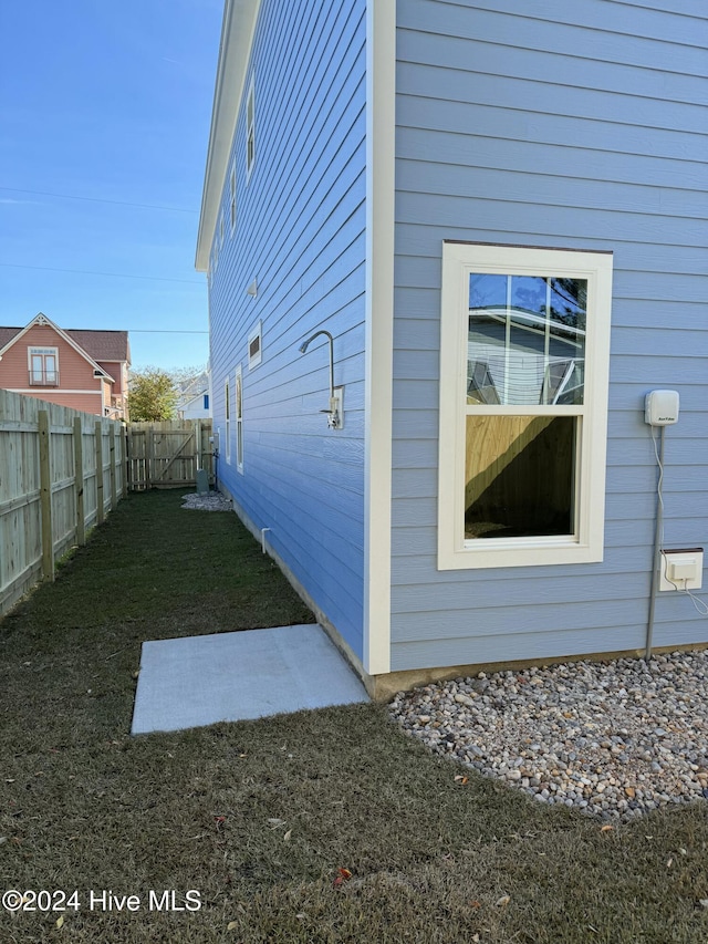 view of home's exterior featuring a lawn