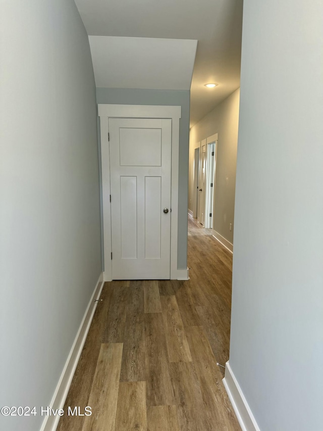 corridor with light wood-type flooring