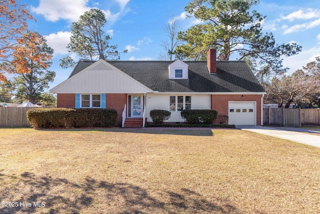 view of front of property with a front yard and a garage