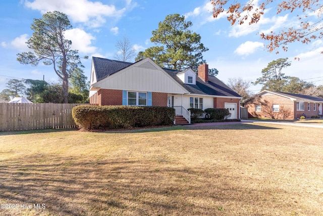 view of front facade featuring a front lawn and a garage