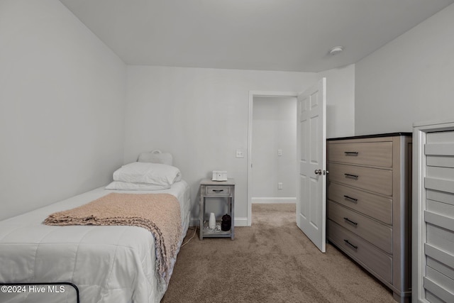 bedroom with light colored carpet