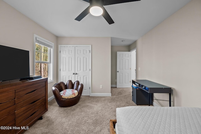 carpeted bedroom with a closet and ceiling fan