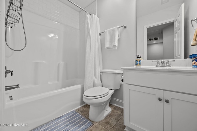 full bathroom with toilet, tile patterned floors, vanity, and shower / tub combo with curtain