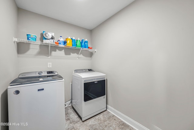 washroom with washer and dryer