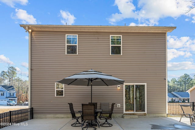 rear view of property featuring a patio area