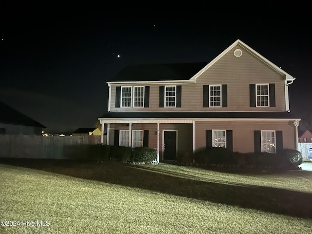 view of front of home with a lawn