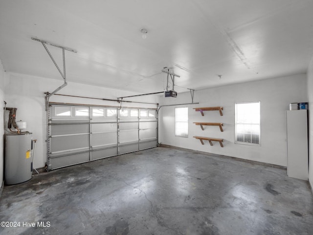 garage featuring a garage door opener and water heater