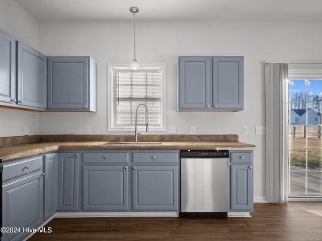 kitchen featuring gray cabinetry, dishwasher, sink, and a wealth of natural light