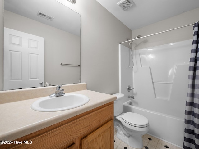 full bathroom with vanity, toilet, and shower / bath combo with shower curtain