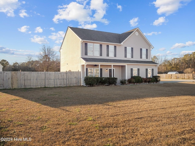 front facade with a front yard