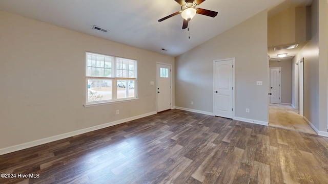 interior space with dark hardwood / wood-style floors, vaulted ceiling, and ceiling fan